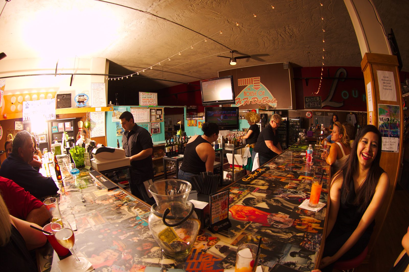 The crowd and bartenders at Fifi’s bar