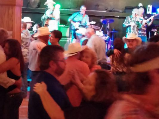 Couples dancing to a live band