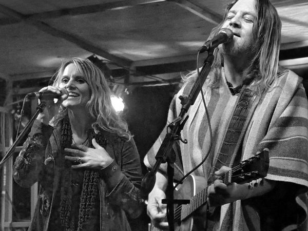 Two singers performing on stage
