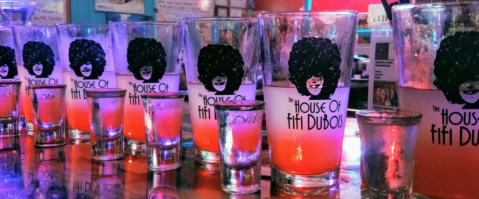 A row of colorful shots in Fifi's glasses